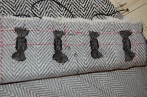 An inside look at the buttonholes in progress