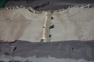 The "couture-constructed" neckline, before the lining is attached.