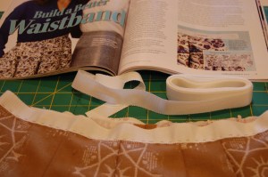 The Petersham ribbon basted onto the waistline.