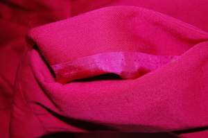 A peek at the pocket inside which shows the raspberry silk lining I used for the dress.  I understitiched the pocket edges by hand, which took no time at all and looks so much nicer than machine stitching!