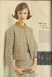 This suit definitely shows shades of Chanel!