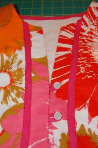 I forgot to add the loops before I sewed the frint neck facing in place. Then I had to open up the seam to accomplish that little task! I turned the loops with a bodkin