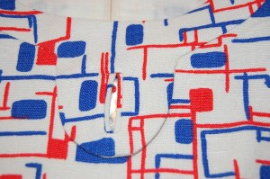 Here's the buttonhole, with the button peeking through!