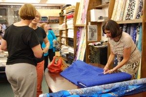 Alice is on the right, in a pose seen often - cutting fabric.