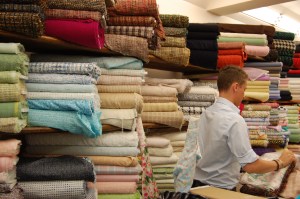 Pierre shown here in front of all those luscious fabrics.