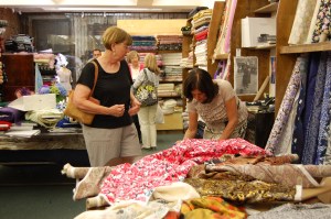 Alice bent over more fabric.