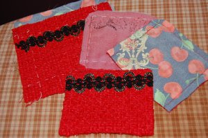 Here are the four pockets, in various stages of completion. I decided to add silk organza interfacing to them (suggested by Susan Khalje, but optional).