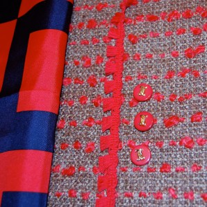 These are shank buttons, with gold decoration reminiscent of Chanel "C"s.