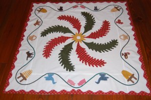 With the red undulating border added. Ready for basting the layers together.