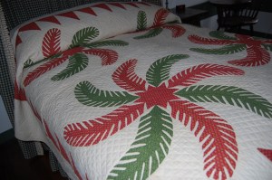 Here is a large classic red and green antique Princess Feather quilt from a private collection.