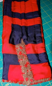 The extension is sewn on separately, leaving three openings, evenly spaced for buttonholes in the seam.