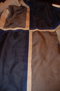 Here is the inside of the back of the coat, with the seams catch-stitched to the organza.