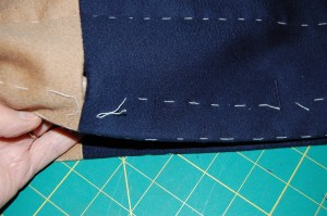 The middle buttonhole is a slot-seam one.