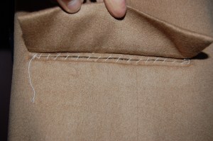 And here is what it looks like under the flap, with the opening basted together temporarily.