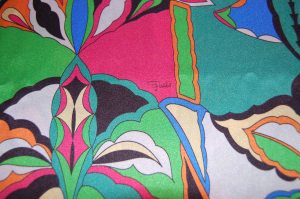 The small "Emilio" signature is at the lower part of the pink section.