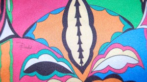 The signature is spread thinly across the expanse of the fabric.