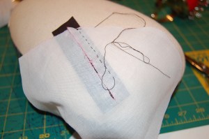 Here I am reinforcing the darts in the bust (cup) interfacings.