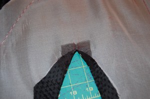 The organza patch is sewn on the right side of the jacket and pressed to the inside.