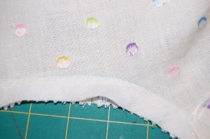 This narrow strip of lining fabric prevents the color of those dots from showing through.