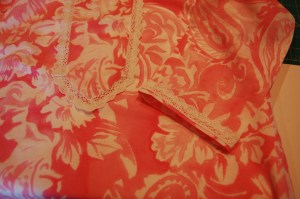 I attached the lace with the straight edge at the bottom of the sleeve, with a narrow margin of fabric showing,
