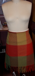  I wrapped the blanket around myself in the store - as a skirt - to test my theory.  Here it is pinned on my dress form 