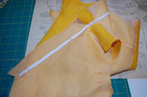 I basted the twill tape just to the outside of the fold line on the "all-in-one" facing.