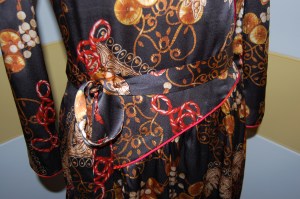 the pieced sash.  I'm glad this fabric design is so busy, otherwise the multiple seams in this sash would definitely show.