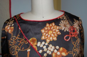 The reset sleeves and the finished neckline, cut a little wider than the pattern.