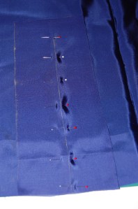 I centered a triangle of the lining fabric (about 10" x 8") on top of the marked line.