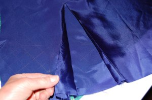 After securing these stitched together pieces across the top through all layers, I had a kick pleat!