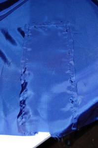 I sewed another piece of ling fabric (10" x 8") to the wrong side of the turned placket. It is stitched around the edges - a little difficult to see.