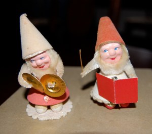 The confident conductor is on the right, while the little guy with the cymbals looks a bit shy.