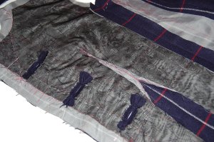 Here is an inside look at the interfaced right side of the jacket showing the underside of the buttonholes.