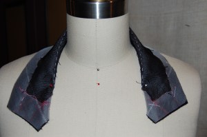 A dress form is indispensable for steaming the undercollar. You can see the basted roll lie in this photo.