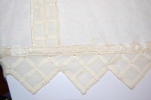 The catch stitch is done across the width of the Snug Hug tape. It is the perfect technique for this application.