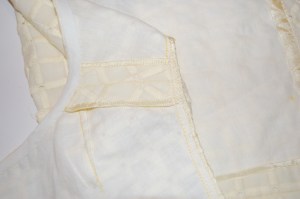 I made a bias tape out of the underlings fabric to bind the neck edge. Seam edges are encased in Hug Snug.