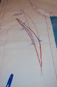 The newly drawn dart is in orange, while its original position is in red.