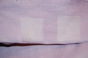 I finished the underside (on the facing) of the buttonholes using organza patches, which makes a beautiful, sturdy finish.