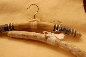 The hanger on the top is from Out of the Closet Hangers; the one on the bottom is from GrandmasChalkboard.