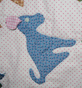 The dog's ear is floppy! I lined it with pink gingham. Here i have it pinned back so you can see it!