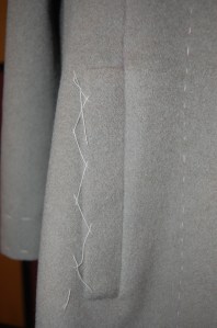 I have the placket catch-stitched temporarily so it does not get caught on something while I finish the remainder of the coat.