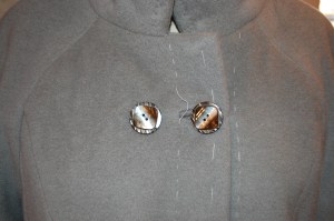 The "square" detail on the buttons picks up the design in the lining fabric.