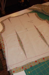 This shows my muslin pattern, cut on the seam lines, and with the darts cut out, so that I could tread trace along all sewing lines.