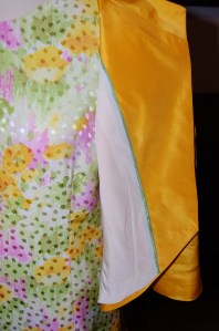 The green piping picks up the green in the dress. I opted for an off-white lining, which is a little boring but that's okay!