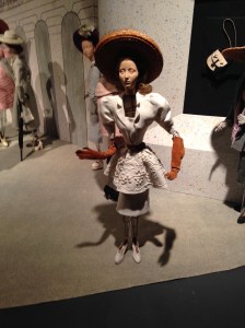 This was actually called a cocktail ensemble, by Madeleine de Rauch. The white cotton embroidery on this synthetic linen was exquisite. She is wearing long cognac suede gloves and white suede shoes, too.