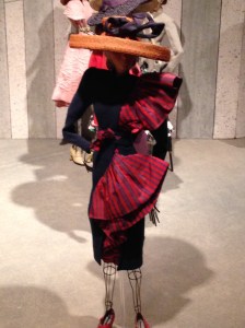 Now this certainly a cocktail ensemble! By Martial & Armand, it feaur=tres a navy wol cat, with a blue and red striped silk faille dress, all topped off with a red straw hat trimmed in navy silk faille. 