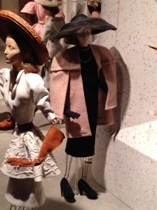 This day ensemble by Robert Piguet shows a pink and gray heather wool box jacket over a black crepe dress, both of which look very current today.