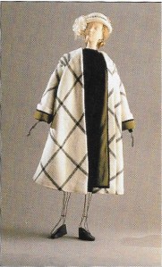 Here is an example of one of the fashions which was not on display, but pictured in the catalogue. This raglan sleeve windowpane check coat is by Alex. Coats similar to this were so in vogue in the 1950s!