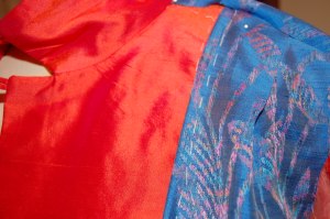 I made a cocktail dress out of the blue fabric and purchased enough to use as the lining for a coordinating coat.