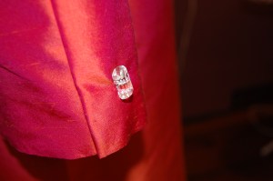 A small, cylindrical, crystal button!